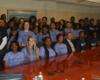 group of female students in blue tshirts